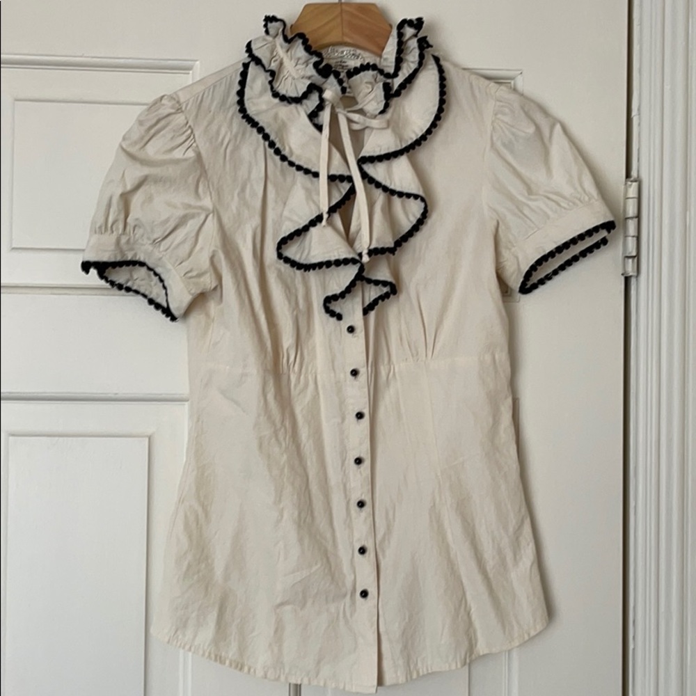 Ruffled blouse with black trim
